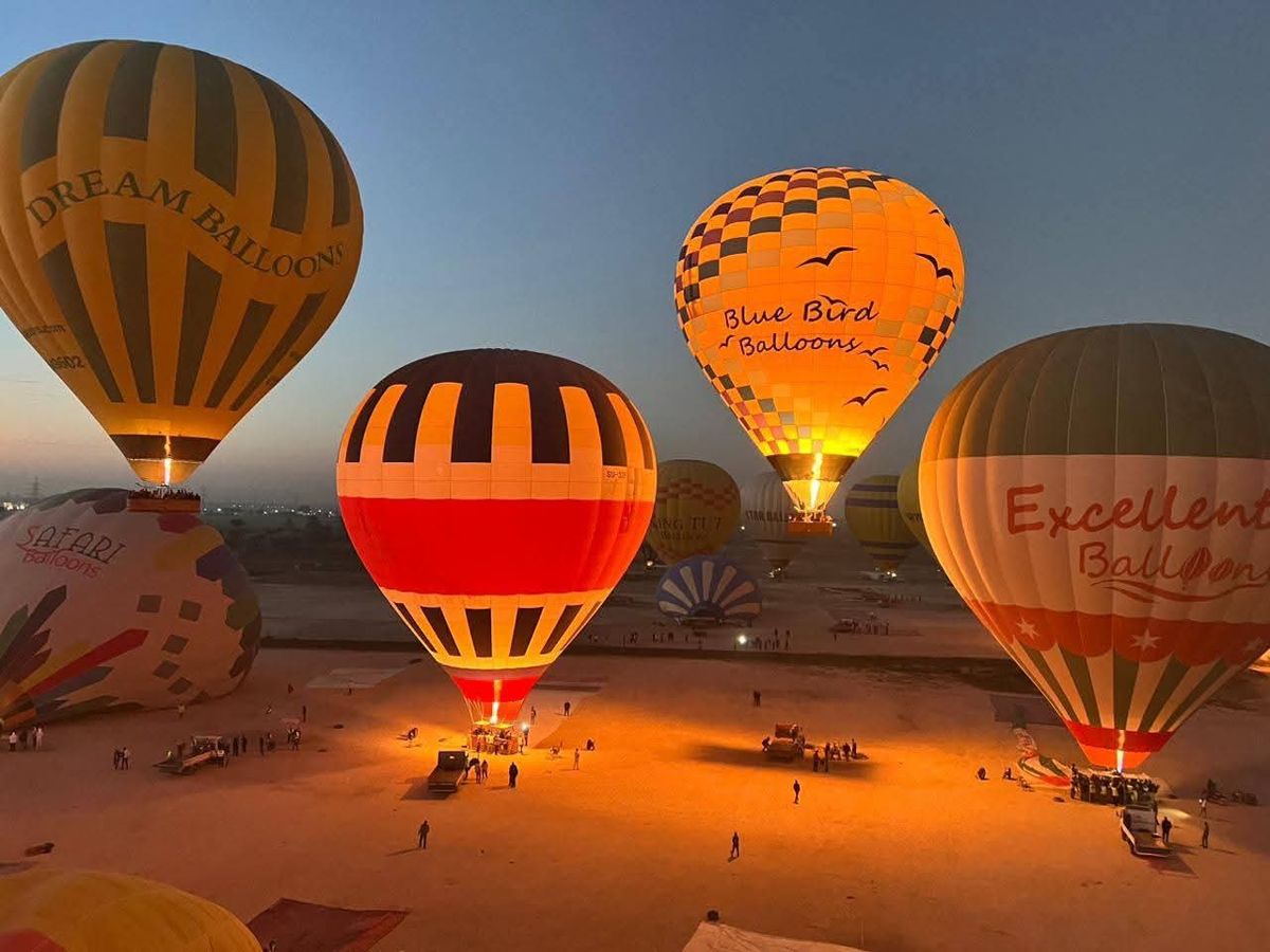 Balloons inflating at the launch field at first light
