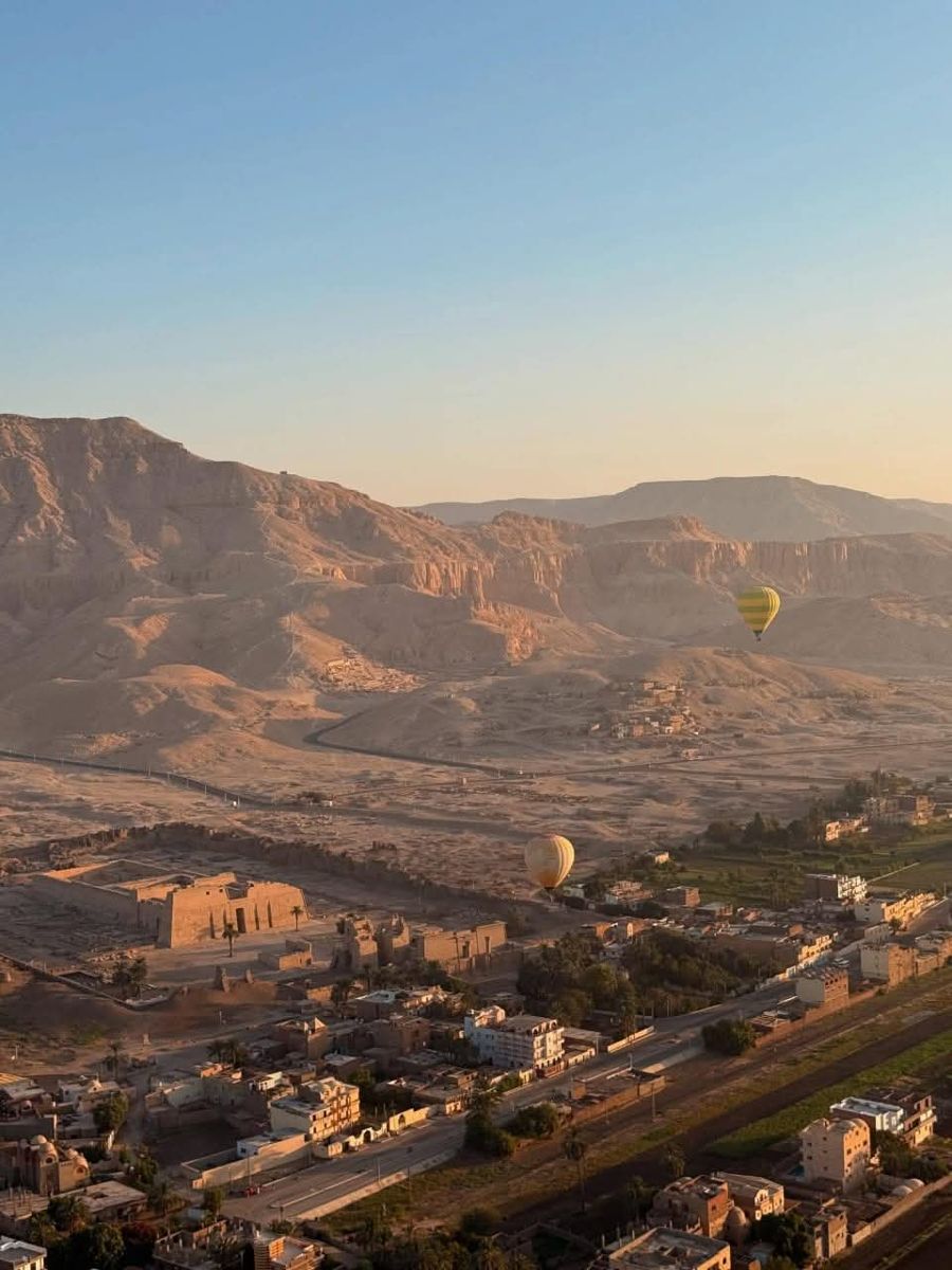 Medinet Habu temple on the West Bank with a balloon overhead